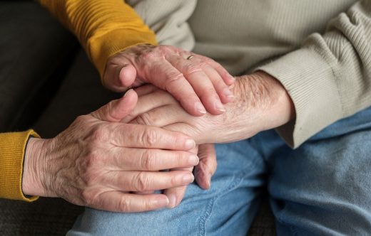 Nursing home holding hands